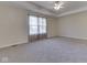 Expansive bedroom featuring plush carpeting and a well-lit window at 1858 Jenny Dr, Martinsville, IN 46151