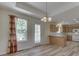Dining area with modern light fixture, view of the backyard, and an open layout at 1858 Jenny Dr, Martinsville, IN 46151