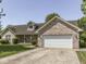 Charming single-story home with brick accents, a two-car garage, and well-maintained landscaping at 1858 Jenny Dr, Martinsville, IN 46151