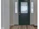 Elegant front door with decorative glass, enhanced by sidelights, set against a neutral interior backdrop at 1858 Jenny Dr, Martinsville, IN 46151