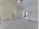 Open living room with vaulted ceilings, neutral carpet, and views into other rooms at 1858 Jenny Dr, Martinsville, IN 46151