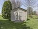 A backyard shed for storage, painted a neutral color to blend in with its outdoor surroundings at 1858 Jenny Dr, Martinsville, IN 46151
