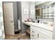 Elegant bathroom featuring a large mirror, modern vanity with drawers and cabinet space at 2075 Longford Ln, Avon, IN 46123