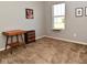Bedroom features an antique table, small black dresser, and window with a cat-perch seat at 2075 Longford Ln, Avon, IN 46123