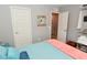 Spacious bedroom with gray walls, two closets, a door to the hallway, and an orange-colored blanket at 2075 Longford Ln, Avon, IN 46123