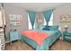 Well-lit bedroom with a queen bed, two windows with curtains, and light blue colored furniture at 2075 Longford Ln, Avon, IN 46123