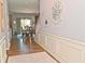 Inviting entryway with hardwood floors, decorative wall art, and a view of the dining room with sliding glass doors at 2075 Longford Ln, Avon, IN 46123