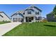 Attractive two-story home featuring a spacious front yard, covered entry, and a well-maintained lawn and landscaping at 2075 Longford Ln, Avon, IN 46123