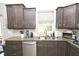 Well-equipped kitchen with stainless steel appliances, a sink with a window view, and ample counter space at 2075 Longford Ln, Avon, IN 46123