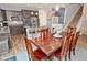Dining area situated next to the kitchen, which is complete with stainless steel appliances and bar seating at 2075 Longford Ln, Avon, IN 46123