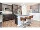 Modern kitchen features stainless steel appliances, granite counters, and bar seating at 2075 Longford Ln, Avon, IN 46123