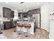 Updated kitchen with stainless steel appliances, a kitchen island, and stylish bar stools at 2075 Longford Ln, Avon, IN 46123