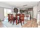 Open-concept kitchen and dining area with stainless steel appliances and stylish lighting at 2075 Longford Ln, Avon, IN 46123