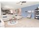 Open living room with access to the kitchen, stairway, and a comfortable chair near decorations at 2075 Longford Ln, Avon, IN 46123