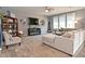 Spacious living room featuring a large sectional sofa, fireplace, and plenty of natural light at 2075 Longford Ln, Avon, IN 46123