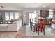 Open-concept living room flows into dining area with sliding glass doors and views of a well equipped kitchen at 2075 Longford Ln, Avon, IN 46123