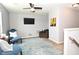 Cozy living room with comfortable seating and a ceiling fan, perfect for relaxation and entertainment at 2075 Longford Ln, Avon, IN 46123