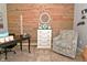 Comfortable home office featuring wood wall, accent chair, and a dark desk with decor at 2075 Longford Ln, Avon, IN 46123