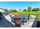 Covered patio with furniture, a hot tub, and a spacious lawn at 2075 Longford Ln, Avon, IN 46123