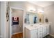 Stylish bathroom with double sink vanity, a mirror, and a view of the toilet room at 2250 Somerset Dr, Franklin, IN 46131