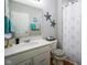Bright bathroom featuring a vanity with a decorative mirror and a shower with a curtain at 2250 Somerset Dr, Franklin, IN 46131