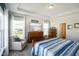 Bright bedroom featuring tray ceilings, hardwood floors, and plenty of natural light at 2250 Somerset Dr, Franklin, IN 46131