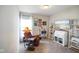 Well-lit bedroom with a cozy reading chair, decorative shelving and a mounted television at 2250 Somerset Dr, Franklin, IN 46131