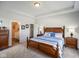 Cozy bedroom features tray ceilings, hardwood floors, and neutral walls at 2250 Somerset Dr, Franklin, IN 46131