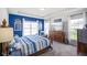 Primary bedroom with tray ceilings, hardwood floors, and plenty of natural light at 2250 Somerset Dr, Franklin, IN 46131