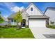 Charming two-story home with a two-car garage, manicured lawn, and beautiful landscaping at 2250 Somerset Dr, Franklin, IN 46131