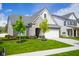 Charming two-story home with a two-car garage, manicured lawn, and beautiful landscaping at 2250 Somerset Dr, Franklin, IN 46131