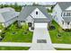 Aerial view of a home with a two-car garage, landscaped yard, and contemporary architecture at 2250 Somerset Dr, Franklin, IN 46131