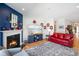 Cozy living room with a fireplace, hardwood floors, and neutral paint at 2250 Somerset Dr, Franklin, IN 46131