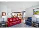 Open-concept living room with modern decor, hardwood floors, and view to the kitchen at 2250 Somerset Dr, Franklin, IN 46131