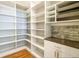 Spacious walk-in pantry with ample shelving and hardwood floors at 2250 Somerset Dr, Franklin, IN 46131