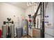 Functional utility room featuring water heater, filtration system, and furnace for efficient home management at 2250 Somerset Dr, Franklin, IN 46131