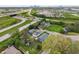 Aerial view showcasing the home's location near highways and neighborhood, set against the backdrop of a city skyline at 2263 N Rural St, Indianapolis, IN 46218