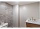 Well lit bathroom with stylish tile, modern fixtures, and marble countertop vanity at 2263 N Rural St, Indianapolis, IN 46218