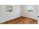 Bedroom featuring hardwood floors and two windows at 2263 N Rural St, Indianapolis, IN 46218