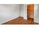Bedroom featuring hardwood floors, closet, and a door at 2263 N Rural St, Indianapolis, IN 46218