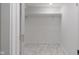 Walk-in closet with built in shelving unit and new flooring at 2263 N Rural St, Indianapolis, IN 46218