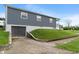 View of house with garage and large yard on a sunny day, featuring side entrance and modern siding at 2263 N Rural St, Indianapolis, IN 46218