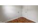 Hallway with hardwood floors, two doors, and electrical outlets at 2263 N Rural St, Indianapolis, IN 46218