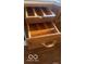 Close up of kitchen drawers with wood front, metal sliding bracket and organizers at 2402 S Rybolt Ave, Indianapolis, IN 46241