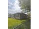 Well maintained single story home with brick facade and green lawn at 2402 S Rybolt Ave, Indianapolis, IN 46241
