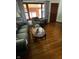Hardwood floors and comfortable furniture make this living room inviting at 2402 S Rybolt Ave, Indianapolis, IN 46241