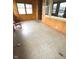 Inviting sunroom featuring wood paneling and large windows for natural light at 2402 S Rybolt Ave, Indianapolis, IN 46241