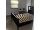 This bedroom features windows providing natural light and has wood flooring at 2425 S Lyons Ave, Indianapolis, IN 46241