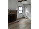This living room has a brick fireplace, and is spacious with natural light at 2425 S Lyons Ave, Indianapolis, IN 46241