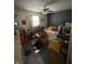 Bedroom filled with belongings highlighting space; showing window, ceiling fan and room size at 2517 Baur Dr, Indianapolis, IN 46220